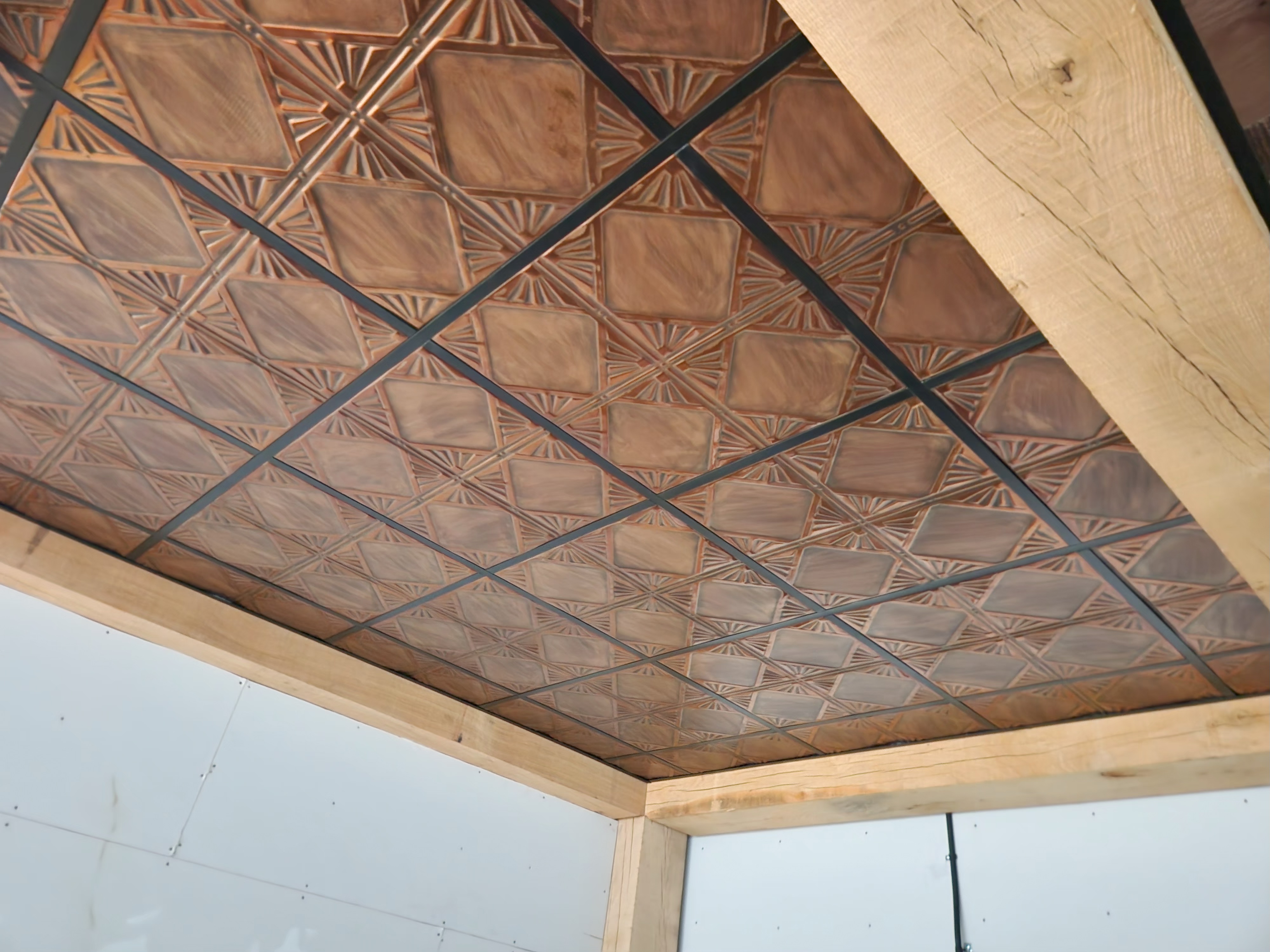 Acoustical ceiling tile detail, decorative metal-look tiles